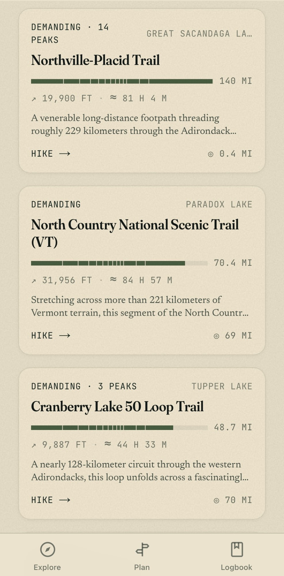 The app's long-distance trails list: the Northville–Placid Trail, the North Country National Scenic Trail, and the Cranberry Lake 50 loop, each with length, elevation gain, estimated book time, difficulty, and distance to the trailhead.